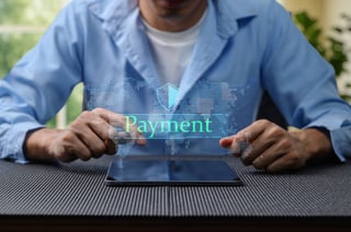 A Person Interacts With A Tablet To Make An Online Payment Featuring A Digital Security Graphic A Person Interacts With A Tablet To Make An Online Payment Featuring A Digital Security Graphic