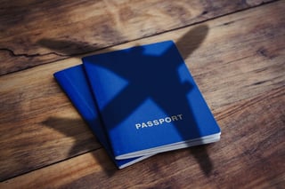 Blue passport with the airplane shadow Blue passport with the airplane shadow