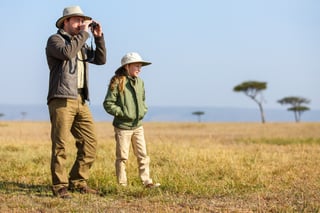 Family of Father and Child on African Safari Vacation Enjoying Bush View Family of Father and Child on African Safari Vacation Enjoying Bush View