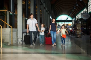 Young Parents With A Daughter And A Son Go Through The Waiting Room At The Station Young Parents With A Daughter And A Son Go Through The Waiting Room At The Station
