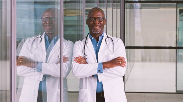 A Doctor Standing In A Modern Hospital