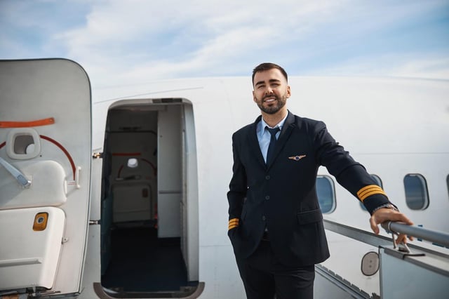 Off Duty Pilot Standing Outside An Aeroplane