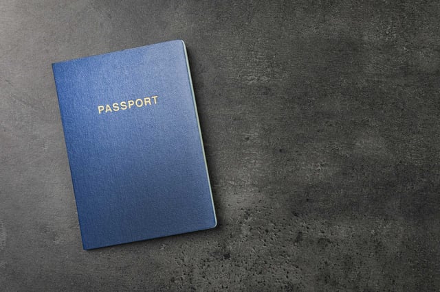 A Passport On A Dark Grey Background