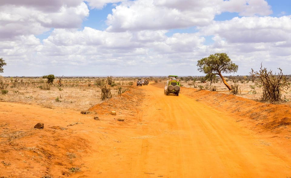 Safari Cars Heading Towards The Savannah In Kenya